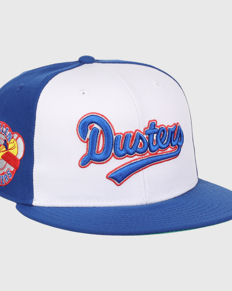 The EFF McAllen Dusters Lone Star Fitted Ballcap features blue and white panels, blue and red McAllen Dusters script embroidery, a winged baseball patch on the side, and a blue brim for classic league style.