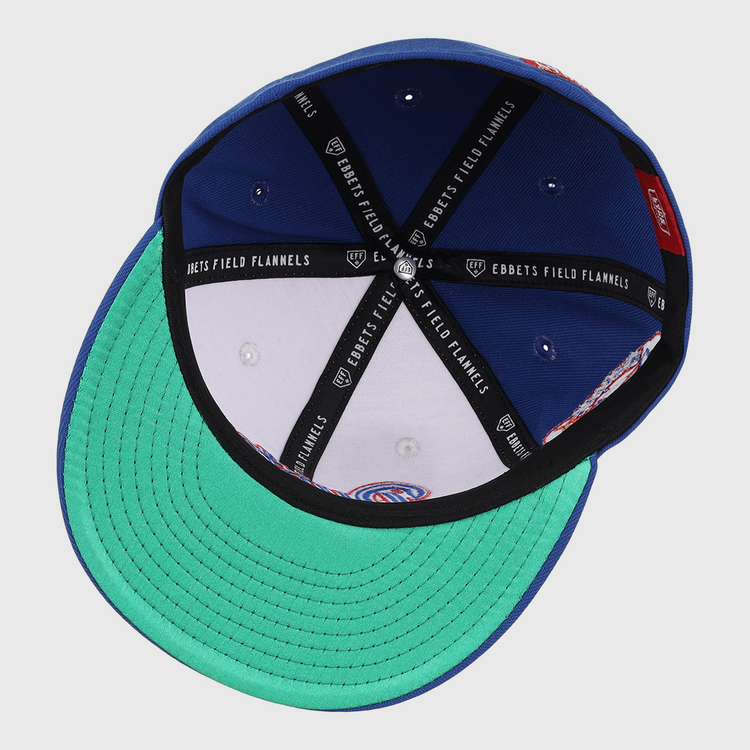 The McAllen Dusters EFF Lone Star Fitted Ballcap by EFF features a green underbrim, blue crown, black and white Ebbets Field Flannels inner piping, silver rivets, and detailed stitching—honoring the Lone Star League’s McAllen Dusters.