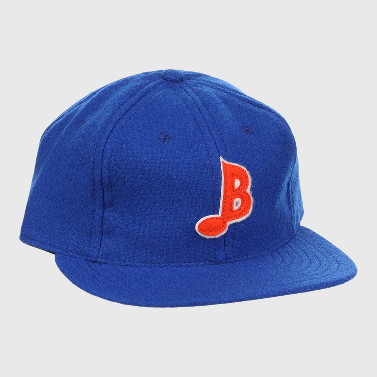 The EFF Memphis Blues Letterhead Wool Vintage Ballcap is a royal blue cap with a flat brim, featuring a red and white stylized B on the front—a classic tribute to Texas League Minor League baseball style.