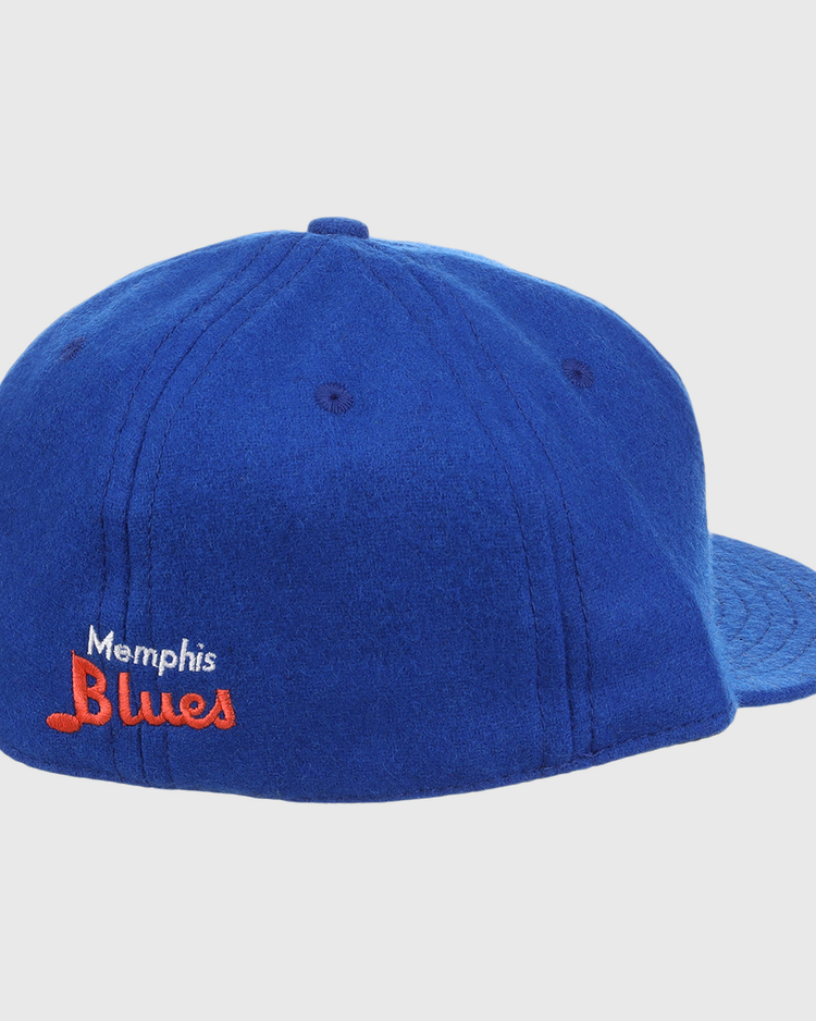 The EFF Memphis Blues Letterhead Wool Vintage Ballcap is blue with Memphis Blues embroidered in white and orange on the back left, a flat brim, and visible top stitching.