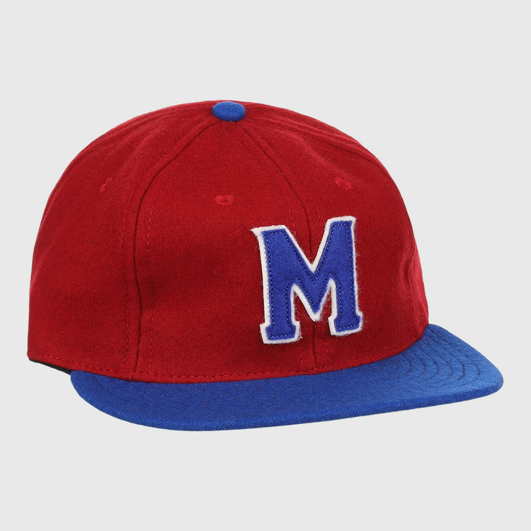 The EFF Memphis Red Sox 1946 Vintage Ballcap features a red wool crown, blue visor, bold blue M outlined in white, and a blue button on top—authentic details inspired by the classic Negro Leagues team.