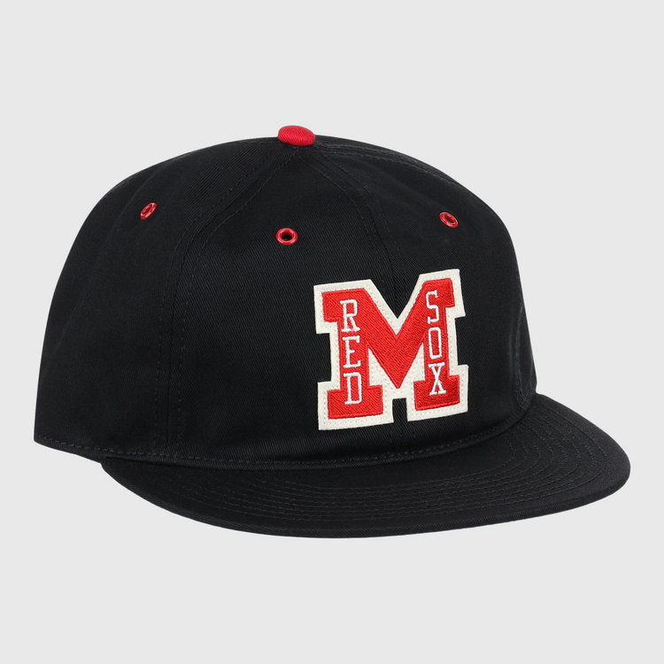 The EFF Memphis Red Sox Cotton Twill Ballcap is a black cap with a red button and eyelets, featuring a bold red M and Red Sox in white—honoring the legendary Negro American League team.