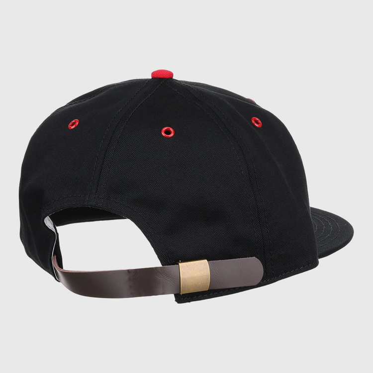 The EFF Memphis Red Sox Cotton Twill Ballcap features black cotton, red eyelets, and a brown adjustable strap with a brass buckle, inspired by the Negro American League team; shown from the back.