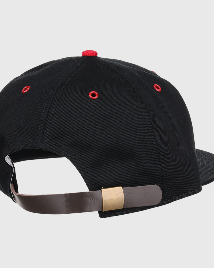The EFF Memphis Red Sox Cotton Twill Ballcap features black cotton, red eyelets, and a brown adjustable strap with a brass buckle, inspired by the Negro American League team; shown from the back.