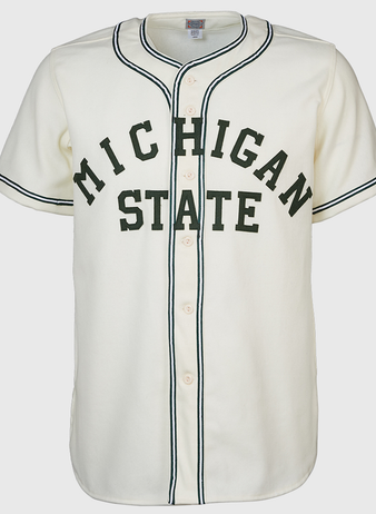 The EFF Michigan State 1940 Home Jersey is a white baseball jersey with black trim, front buttons, and MICHIGAN STATE in large dark green letters across the chest for a vintage collegiate look.