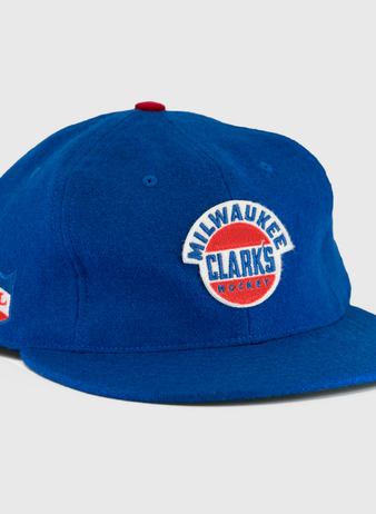 The EFF Milwaukee Clarks Vintage Ballcap is a blue wool cap with Milwaukee Clarks Hockey embroidered on the front and an IHL patch on the side—ideal for hockey fans and collectors.