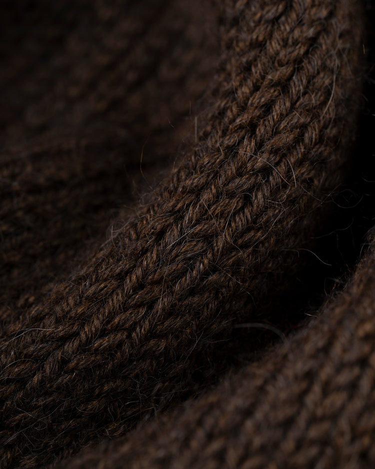 Close-up of the San Diego Padres 1969 Wool Shawl Collar Sweater by Ebbets Field Flannels, highlighting its soft brown knit echoing the teams classic colors with detailed texture and a thick, warm weave.