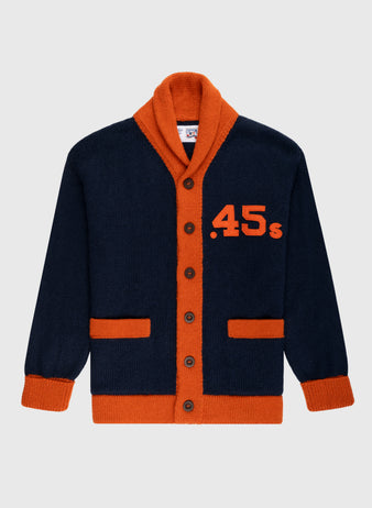 The Ebbets Field Flannels Houston Colt .45s 1962-64 Wool Shawl Collar Sweater is navy with orange trim, collar, cuffs, and pockets. Inspired by vintage baseball sweaters, it has brown buttons and large orange .45s on the left chest.