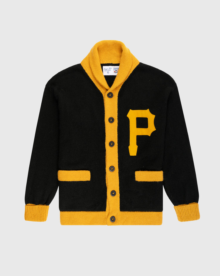 The Ebbets Field Flannels Pittsburgh Pirates 1970 Wool Shawl Collar Sweater is a black cardigan with yellow trim, buttons, pockets, and a large yellow P on the left chest. Inspired by vintage baseball sweaters, it features a shawl collar and ribbed cuffs.
