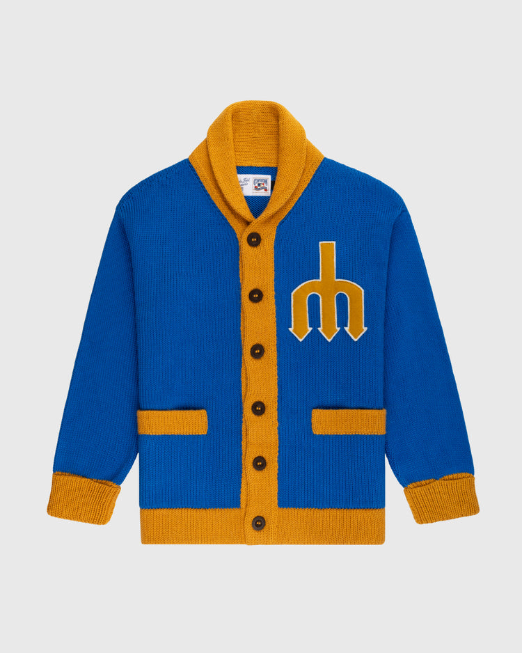 The Ebbets Field Flannels Seattle Mariners 1977-80 Wool Shawl Collar Sweater features royal blue wool, mustard yellow trim and pockets, brown buttons, and a yellow trident logo on the chest for a vintage MLB look.