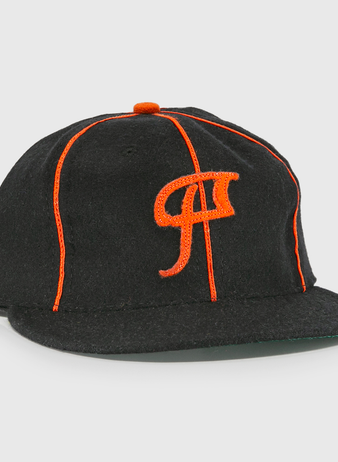 The EFF Montreal Black Panthers 1936 Vintage Ballcap is a black cap with orange piping, a stylized P on the front, flat brim, and small orange top button—classic Quebec Provincial League style.