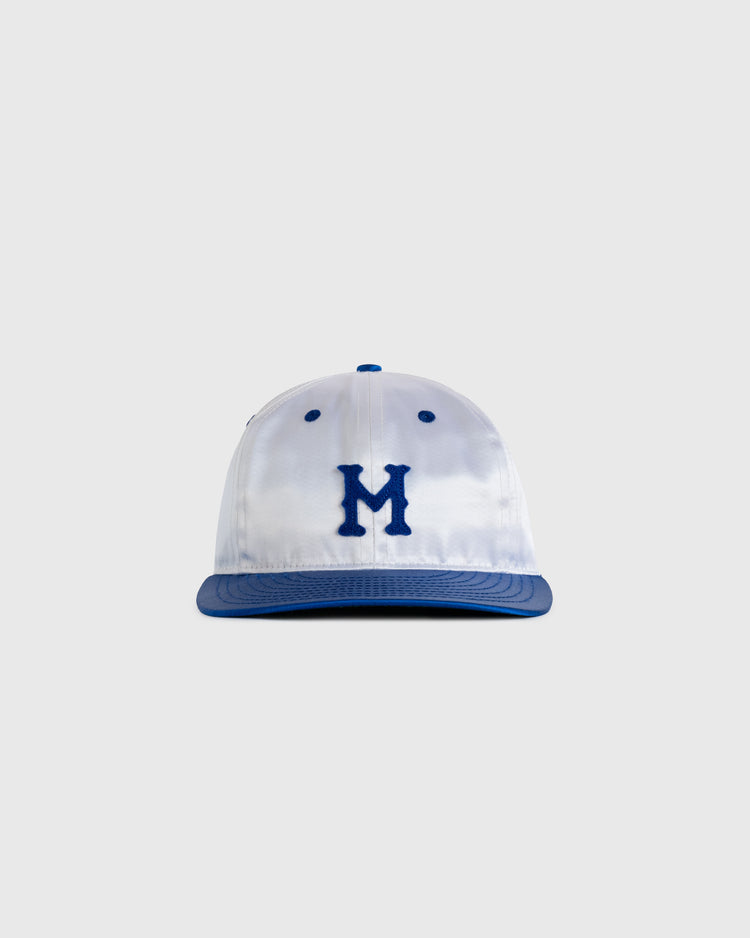 The EFF Montreal Royals 1946 Authentic All Satin Ballcap features a white crown, blue brim, and bold blue M on the front, shown against a plain light gray background.