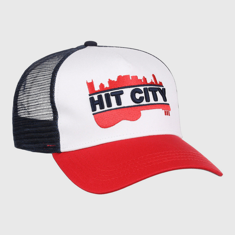 The Ebbets Field Nashville Sounds MiLB Logo Wordmark Trucker Ballcap features a white front, red brim, black mesh back, and a bold red guitar with city skyline and 