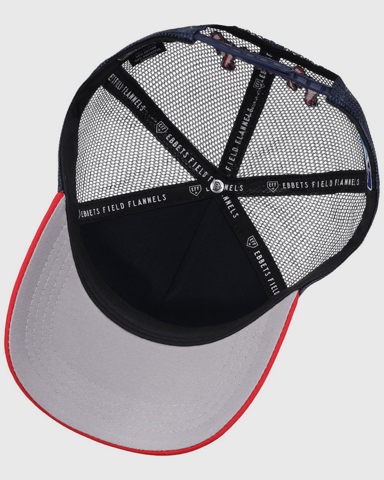 The underside of the Nashville Sounds MiLB Logo Wordmark Trucker Ballcap by Ebbets Field features black mesh panels, a gray brim with a red edge, and black interior taping labeled Ebbets Field Flannels.