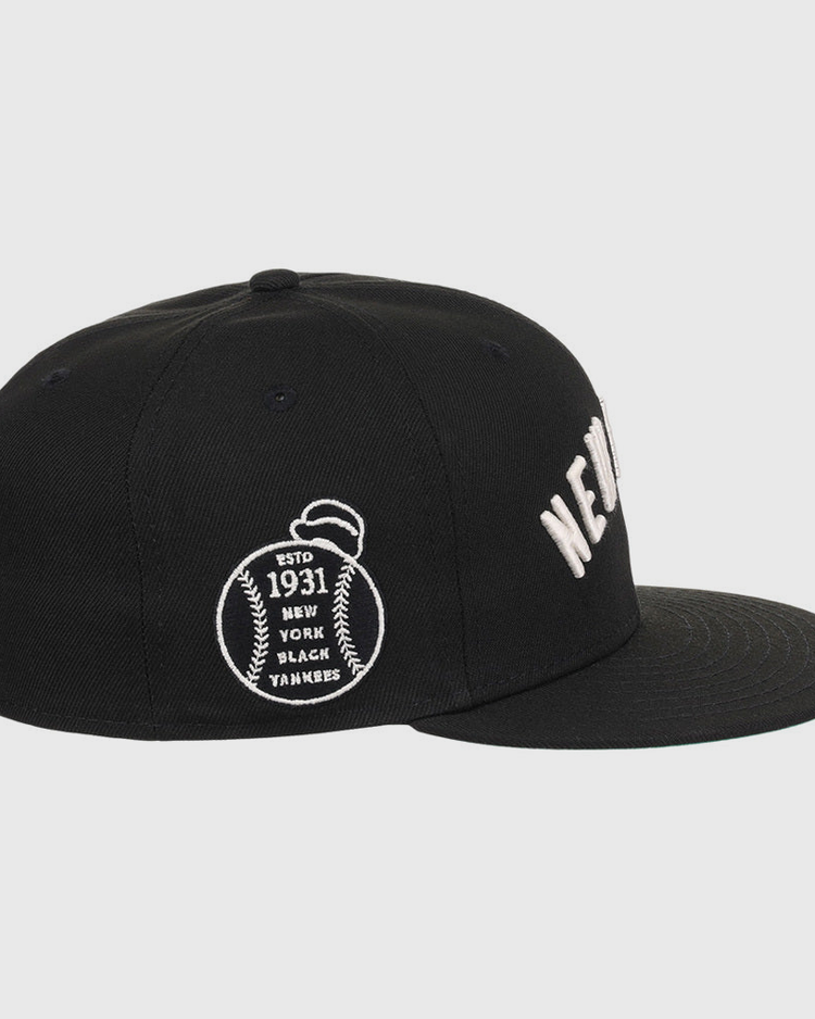 The Ebbets Field New York Black Yankees NLB Black/White Fitted Ballcap features white embroidered 