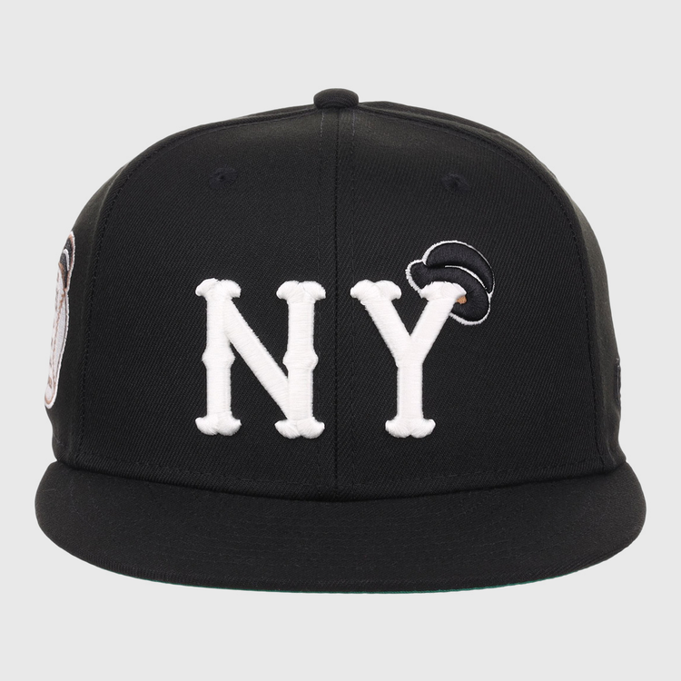 The EFF New York Black Yankees NLB Flip Fitted Ballcap features large white NY letters on the front and a small black and white patch above the Y, inspired by the historic team.