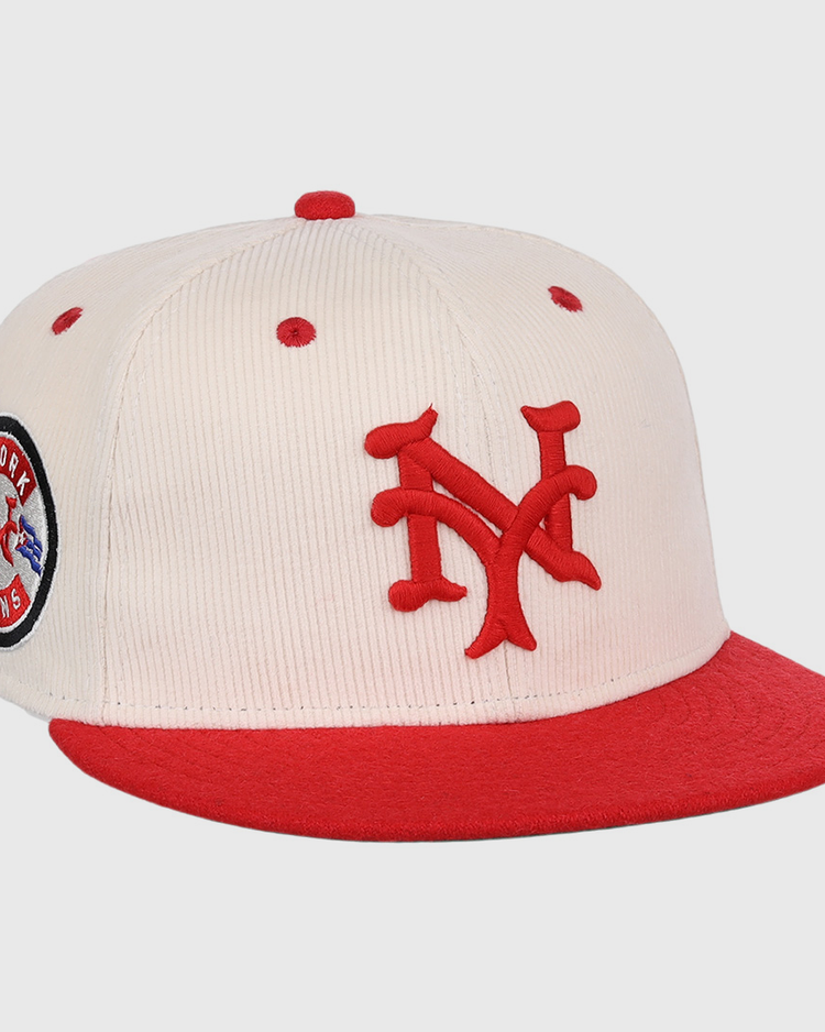 The EFF New York Cubans NLB Ground Rule Double Fitted Ballcap is a cream cap with a red brim, 3D NY embroidery, and a circular New York Cubans patch, inspired by Negro National League style.