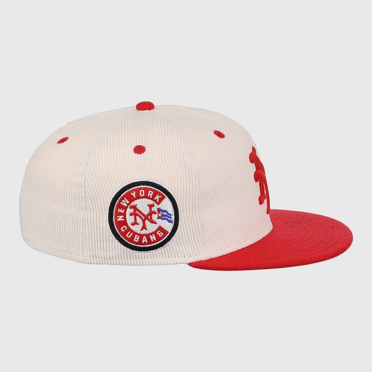 The EFF New York Cubans NLB Ground Rule Double Fitted Ballcap features cream corduroy, a red brim and button, a 3D NY logo, and a side patch reading New York Cubans in blue and red, honoring the Negro National League.