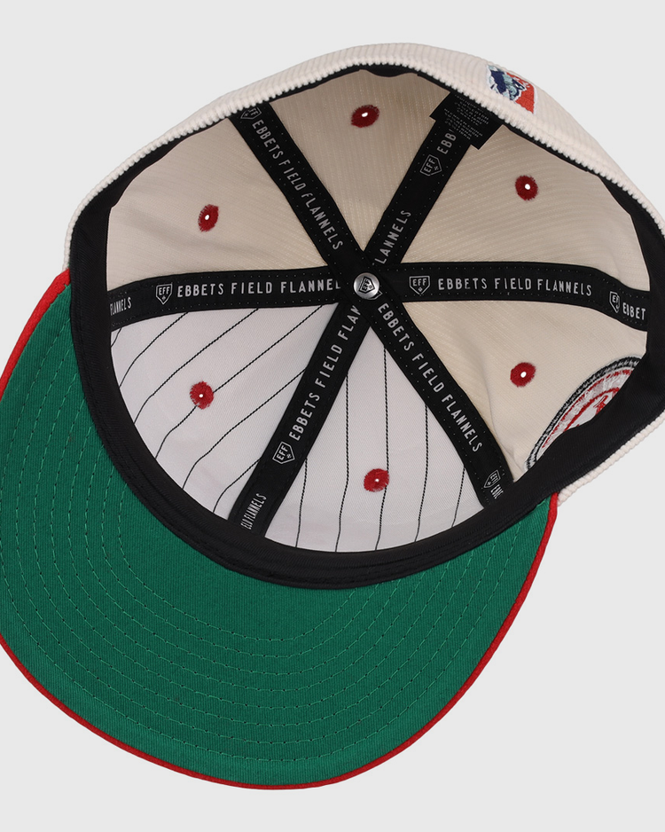 The underside of the EFF New York Cubans NLB Ground Rule Double Fitted Ballcap features a green brim, cream pinstriped interior, red stitched vents, and black EFF taping—honoring the Negro National League’s legacy.