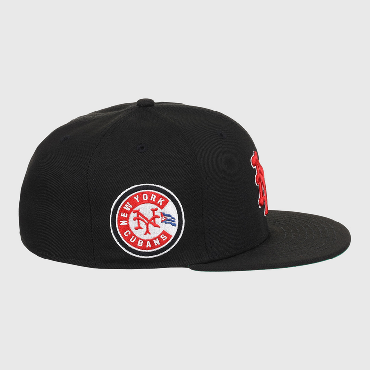 The EFF New York Cubans NLB Team Color Fitted Ballcap is a black vintage-inspired cap with a flat brim, featuring a circular patch reading New York Cubans with a red baseball logo and blue accents, honoring the Negro National League.