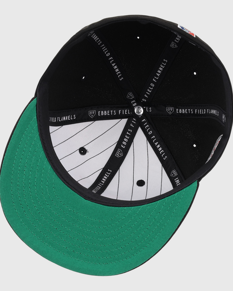 The EFF New York Cubans NLB Team Color Fitted Ballcap features a green under brim, white pinstripe interior, black panels, “Ebbets Field Flannels” on the sweatband, and a 3D NY logo honoring the Negro National League legacy.