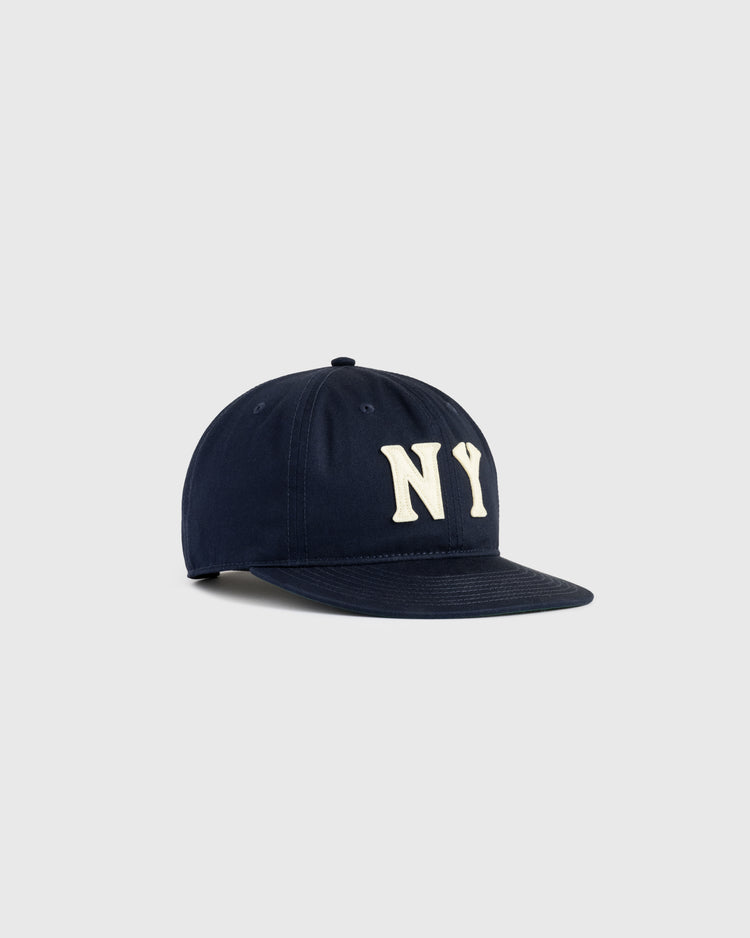 The Ebbets Field New York Black Yankees Felt NY Cotton Twill Ballcap features bold white NY lettering on a navy twill crown with a flat brim, shown against a light gray background.