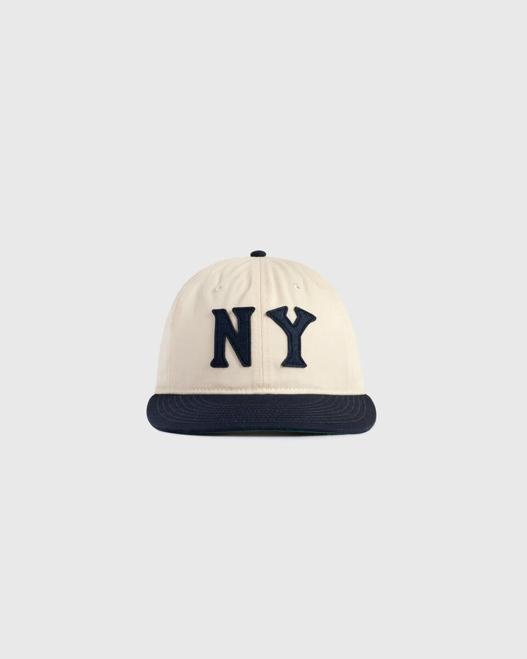 The Ebbets Field New York Black Yankees Felt NY Cotton Twill Ballcap features a cream cotton twill crown, black brim, and large black NY felt letters, inspired by classic Black Yankees caps, shown on a plain light gray background.