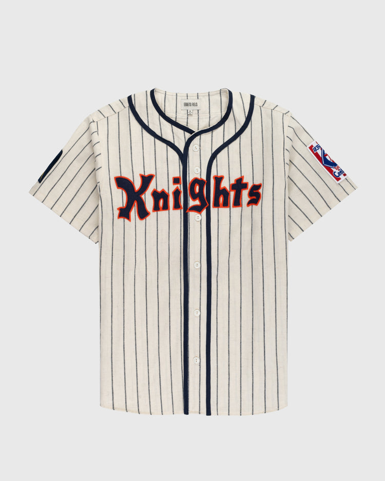 The Ebbets Field New York Knights 1939 Authentic Wool Home Baseball Jersey from The Natural features cream wool with black pinstripes, navy trim, a stars-and-stripes patch, and Knights in red and black across the chest.