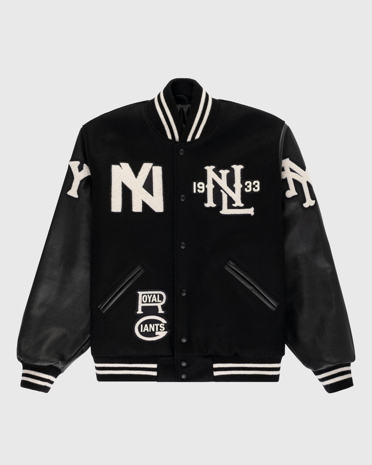 The Ebbets Field Negro League Wool & Leather Varsity Jacket features black wool, black leather sleeves with white letter patches, striped cuffs and collar, plus bold “NY” and “NL 1933” patches on the front.