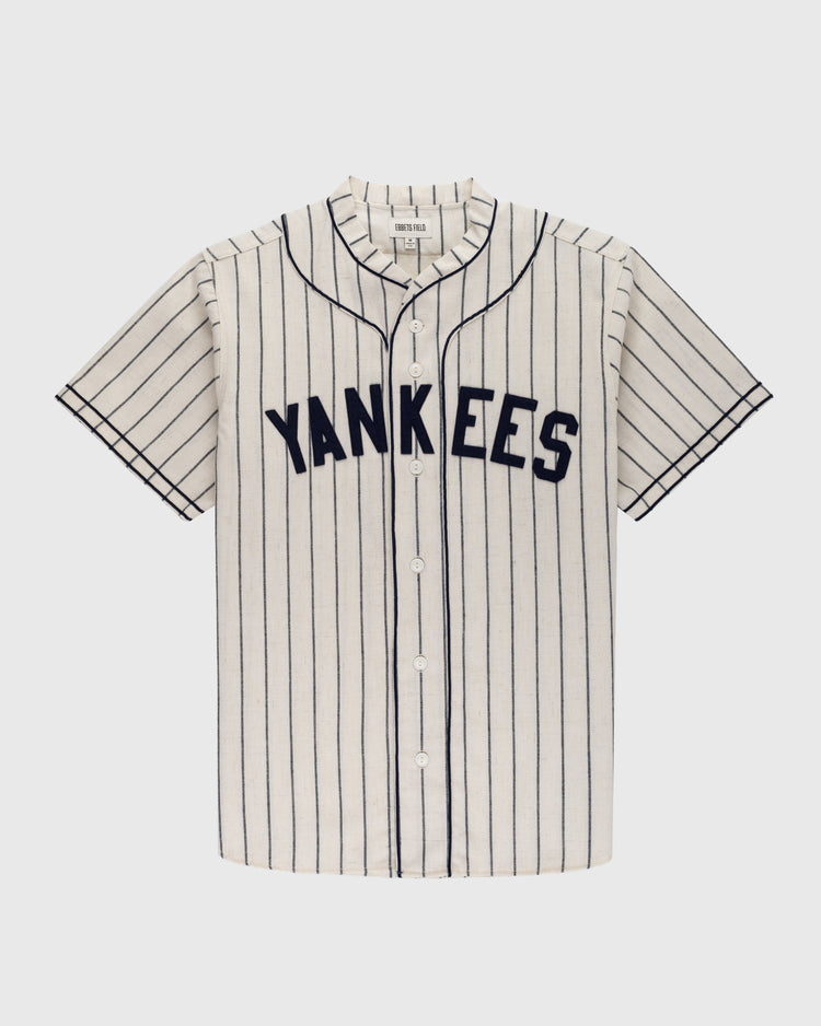 The Ebbets Field New York Black Yankees 1935 Authentic Wool Home Baseball Jersey features short sleeves, a button-up front, classic vertical navy pinstripes on white, and YANKEES across the chest in bold navy letters.