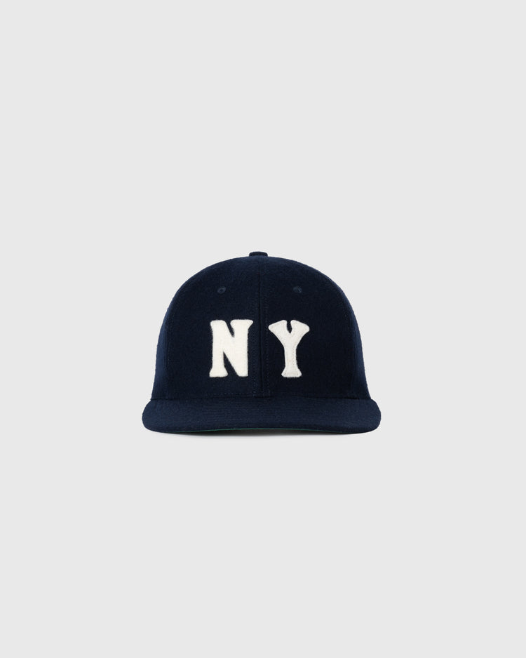 The EFF New York Black Yankees 1936 Authentic Wool Ballcap is navy blue with large white NY letters on the front, inspired by a classic design, and shown against a light gray background.