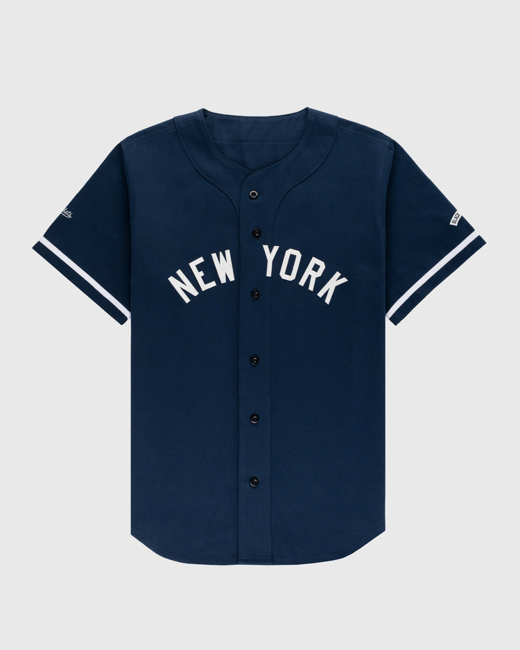 The Ebbets Field New York Black Yankees Cotton Twill Baseball Jersey features NEW YORK in white letters across the chest and white sleeve stripes, shown against a plain light background.