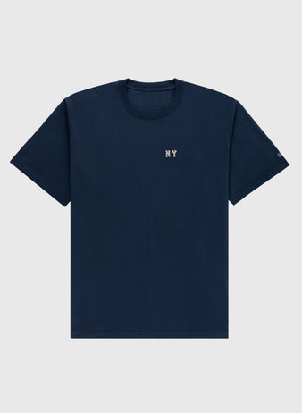The Ebbets Field New York Black Yankees Embroidered NY Short Sleeve Tee features small white NY text on a plain navy blue vintage-style shirt, inspired by the Black Yankees, laid flat on a light gray background.