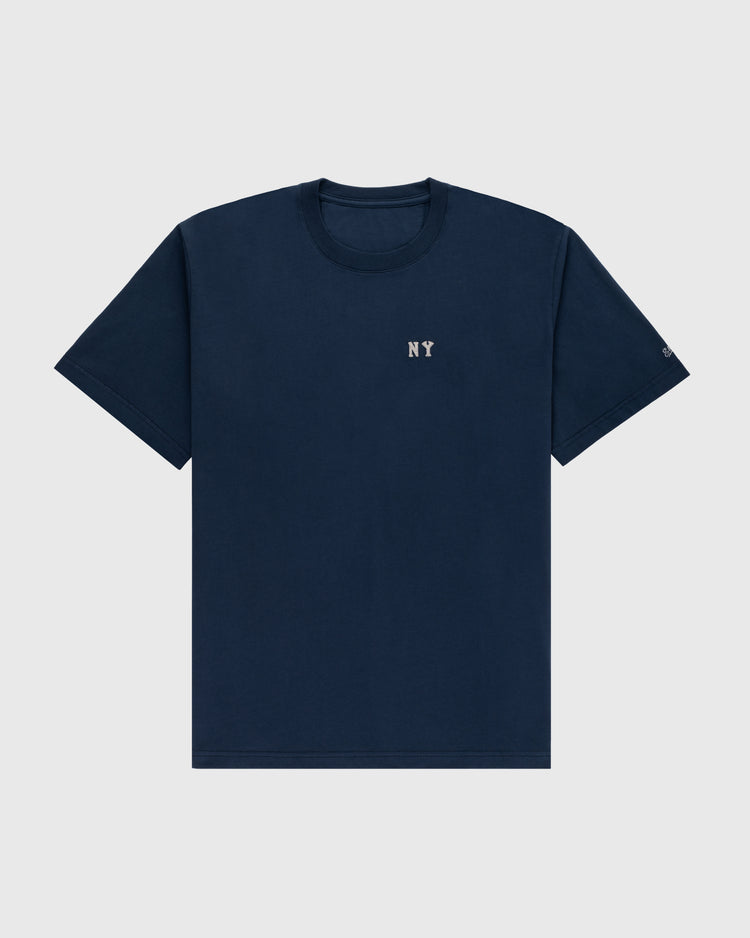 The Ebbets Field New York Black Yankees Embroidered NY Short Sleeve Tee features small white NY text on a plain navy blue vintage-style shirt, inspired by the Black Yankees, laid flat on a light gray background.