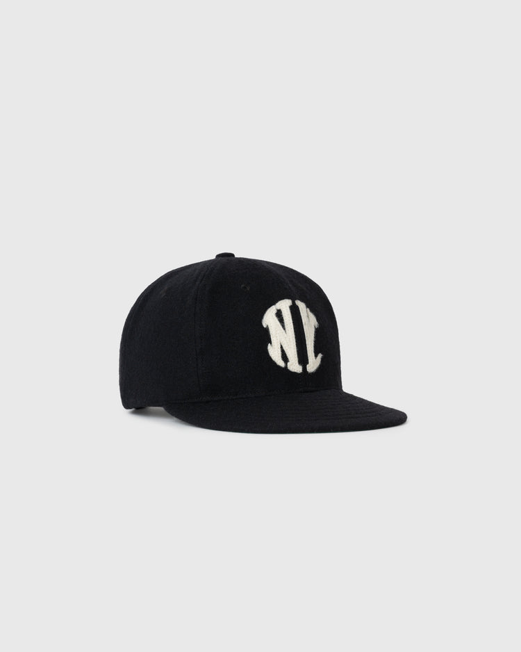 The EFF New York Knickerbockers 1912 Authentic Wool Ballcap is a black vintage cap with a curved brim and bold white NY logo, inspired by the 1912 team, shown against a plain light gray background.