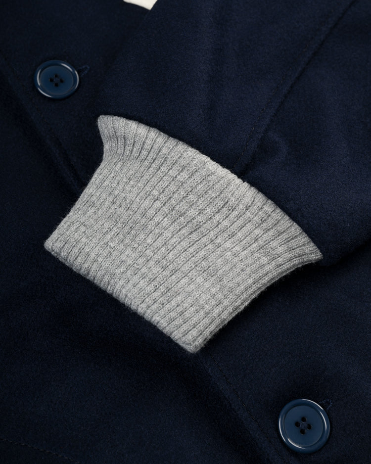 Close-up of the EFF New York Yankees 1936 Authentic All Wool Varsity Jacket, showing navy wool, blue buttons, and light gray ribbed knit cuffs that highlight the detailed texture and stitching.