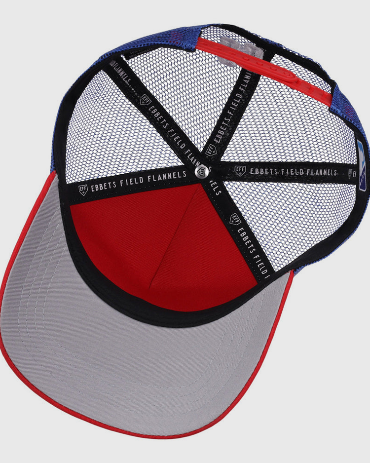 A top-down view of the Oklahoma City 89Ers MiLB Trucker Ballcap by Ebbets Field, featuring blue and red mesh, black sweatbands with 