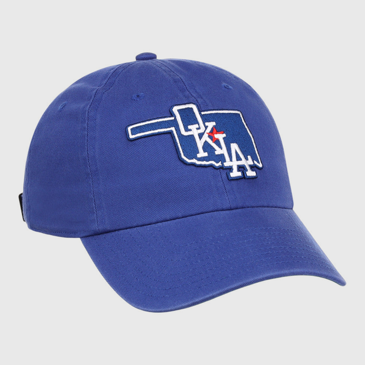 The Ebbets Field Oklahoma City Dodgers MiLB Dad Ballcap is a blue cap featuring an outline of Oklahoma with 
