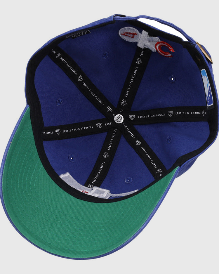 Inside view of the Ebbets Field Oklahoma City Dodgers MiLB Dad Ballcap: blue exterior, green underbrim, black lining bands, white seam tags, small ventilation holes, and branded stitching.