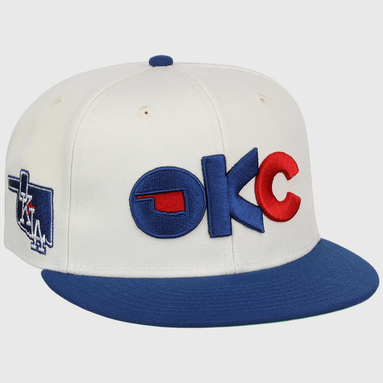 The Oklahoma City Dodgers MiLB Snapback Ballcap by Ebbets Field is a white cap with a blue brim, 