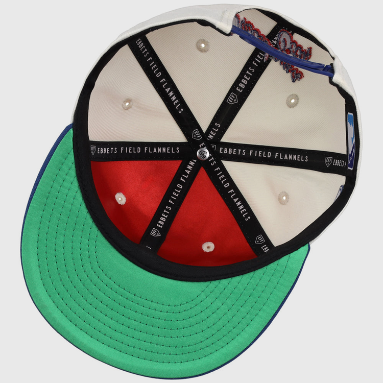 Inside view of the Oklahoma City Dodgers MiLB Snapback Ballcap by Ebbets Field, showing black branded lining, red and white interior panels, white stitched eyelets, and a green underbrim.
