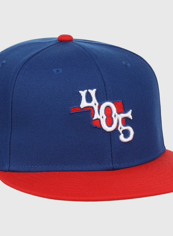 The Ebbets Field Oklahoma City Dodgers MiLB Two Tone Snapback Ballcap features blue and red colors, a 405 front logo, a red top button, and a white star with 
