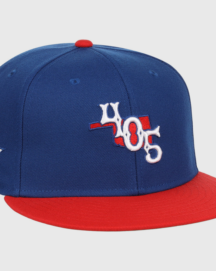 The Ebbets Field Oklahoma City Dodgers MiLB Two Tone Snapback Ballcap features blue and red colors, a 405 front logo, a red top button, and a white star with 