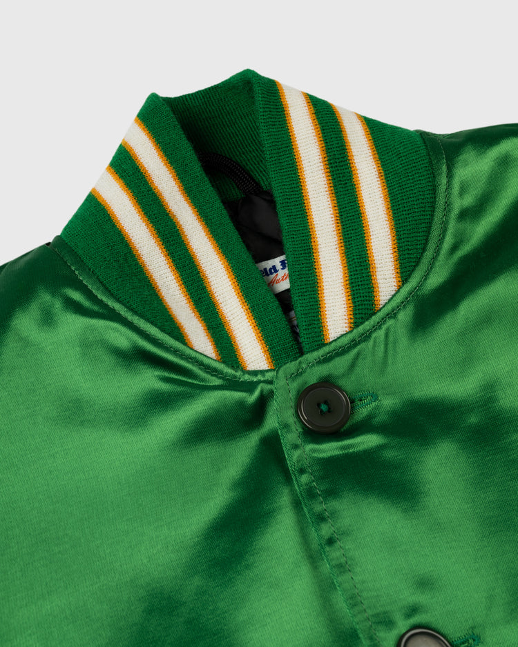 Close-up of the EFF Oakland Athletics 1968 Authentic All Satin Varsity Jacket: a shiny green vintage jacket with a ribbed collar in green, white, and yellow stripes, and two dark green buttons on the front.