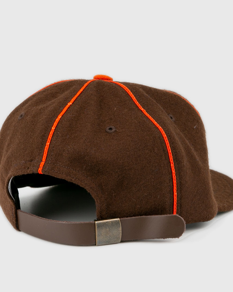 The EFF Pocatello Bannocks 1952 Vintage Ballcap is shown from the back, highlighting orange seam stitching and an adjustable leather strap with a metal buckle.