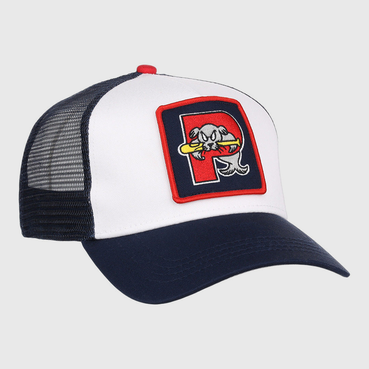 The Ebbets Field Portland Sea Dogs MiLB Trucker Ballcap features a white front, navy blue bill and mesh back, plus a patch with a stylized fish holding a bat inside a red-bordered 