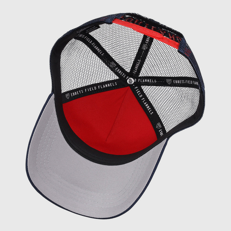 Inside the Portland Sea Dogs MiLB Trucker Ballcap by Ebbets Field, black mesh panels, a red fabric section, a gray brim, and black strips labeled Ebbets Field are visible.