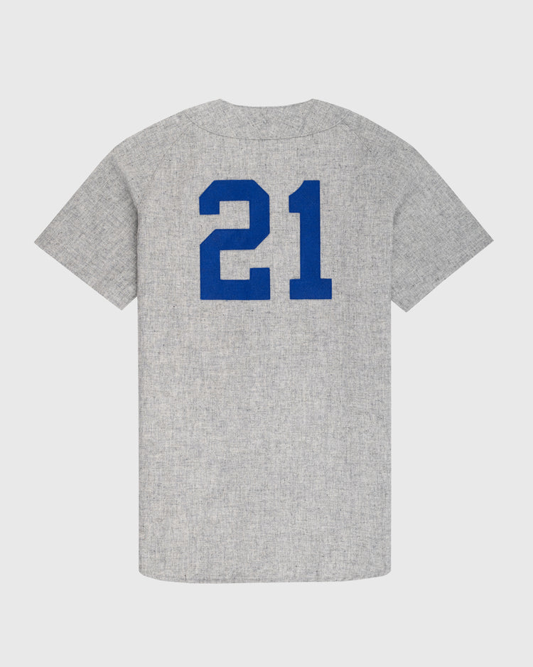 The Puerto Rico 1958 National Team Authentic Wool Road Baseball Jersey by Ebbets Field features a gray design with large blue 21 on the back, inspired by vintage baseball uniforms, displayed on a plain white background.