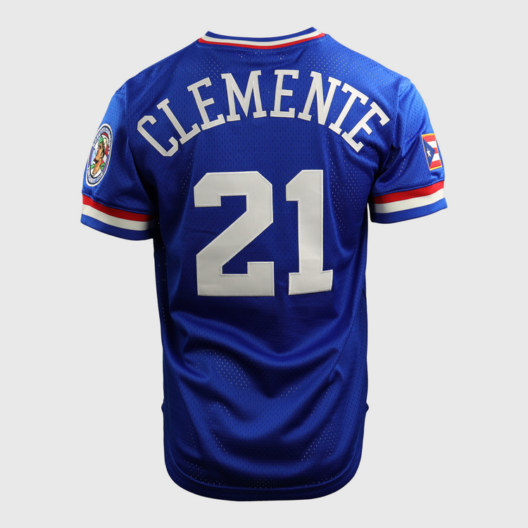 The EFF Roberto Clemente Santurce Cangrejeros Vintage Inspired NL Replica V-Neck Mesh Jersey in royal features white Clemente 21 on the back, a right sleeve patch, and a Puerto Rican flag patch on the left sleeve.