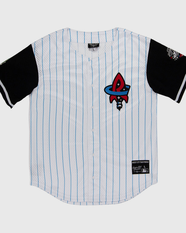 The Ebbets Field Rocket City Trash Pandas MiLB Button Down Jersey is white with thin blue stripes, black sleeves, a red and black rocket logo on the chest, and patches on the lower front and left sleeve.